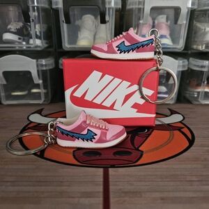 Nike SB pair of mini sneakers keychain.